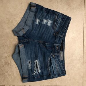 medium wash destroyed denim midi shorts
